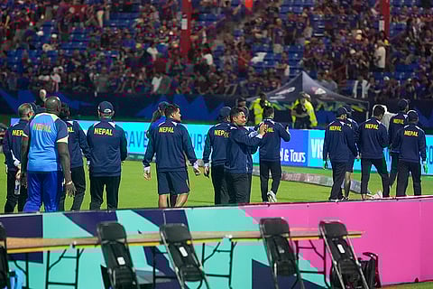 Nepal players gesture to fans